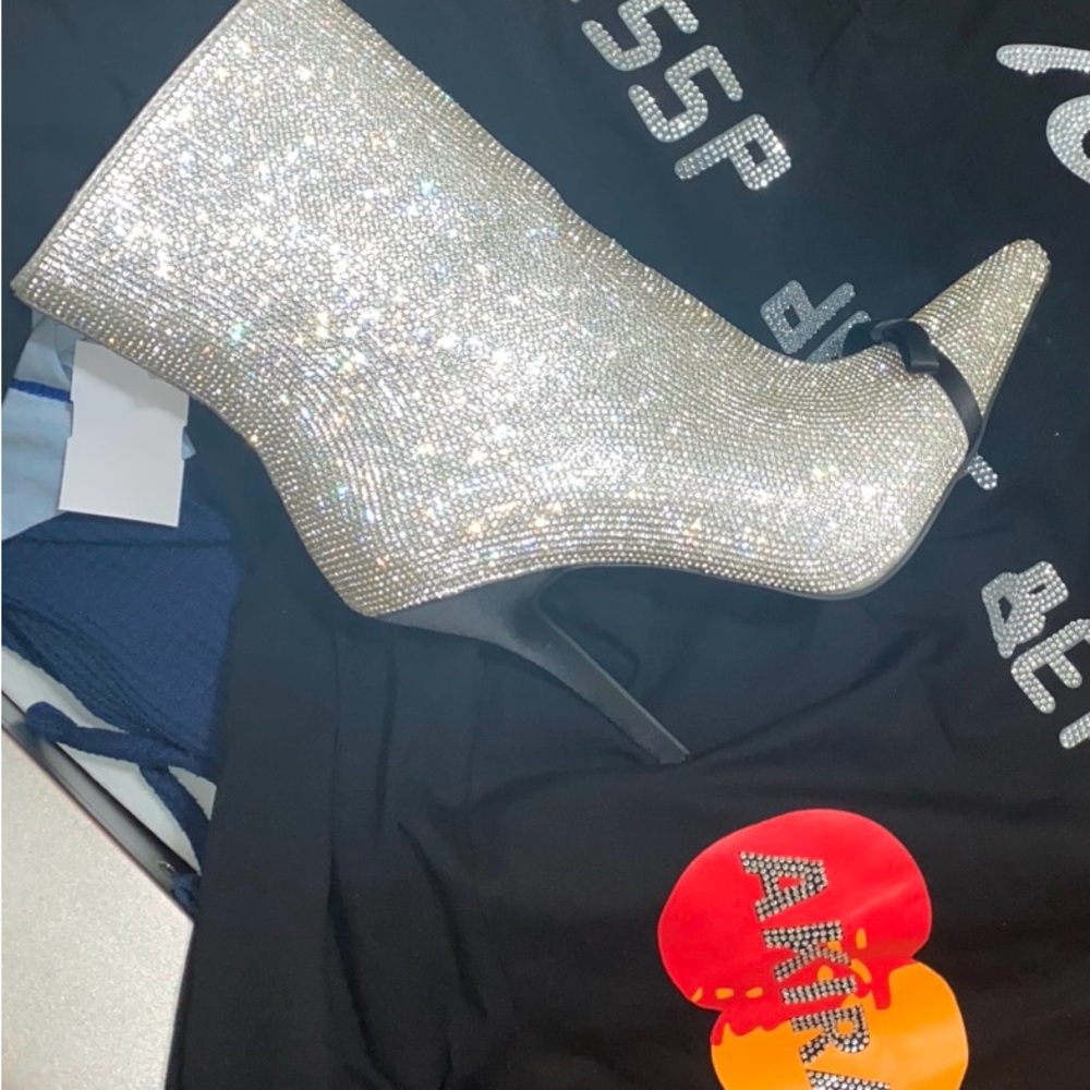 Brand New in the box 
Dazzling Silver Heeled Boots